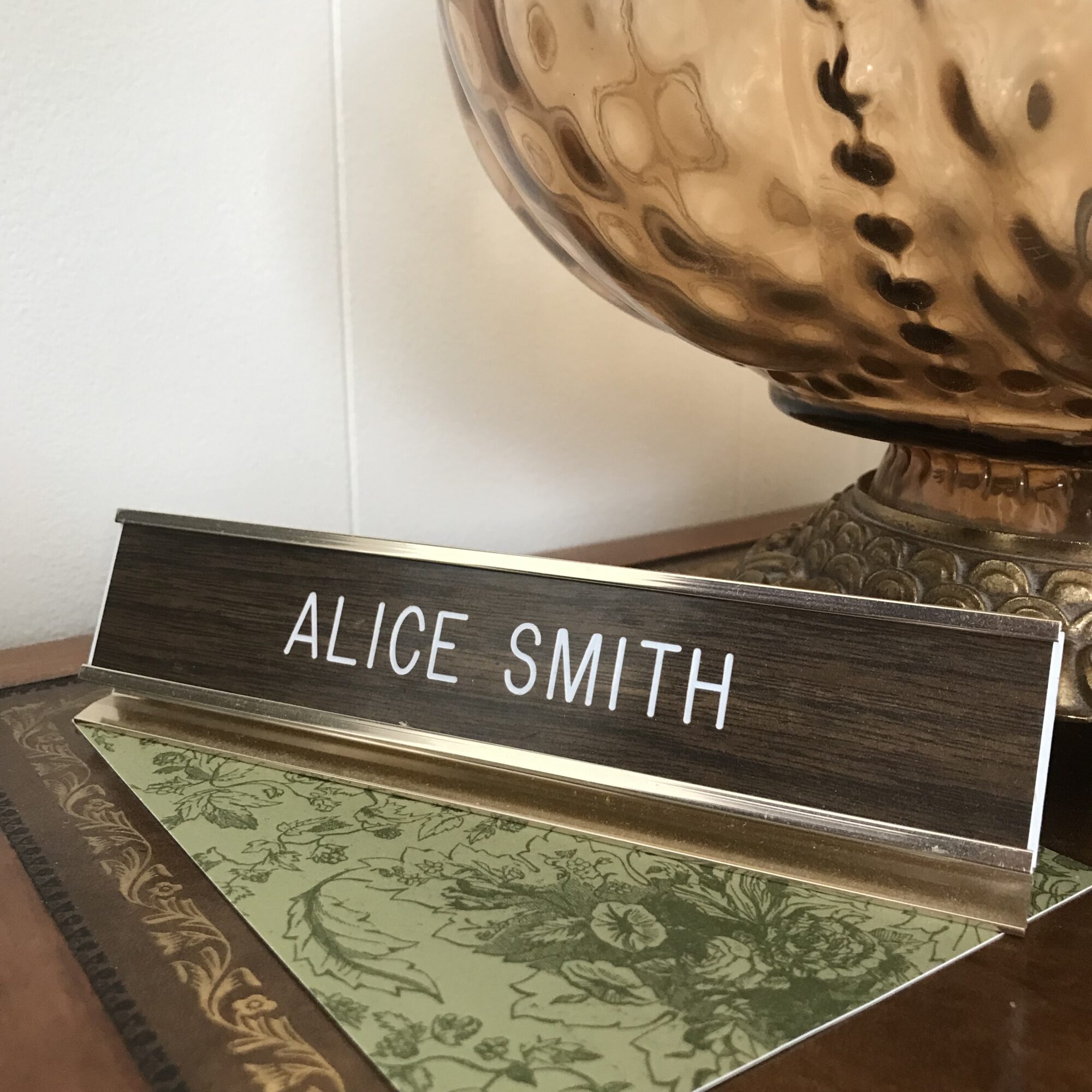 Photo of a nameplate reading Alice Smith.
