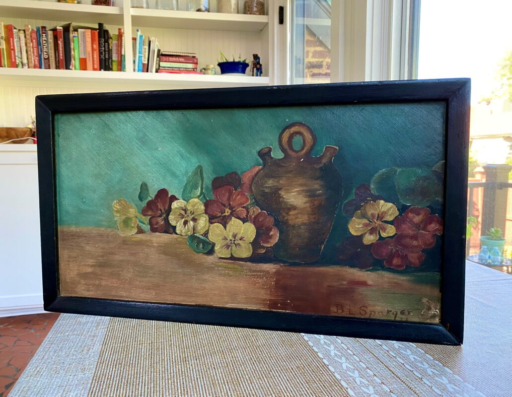 Photo of a large still life painting.