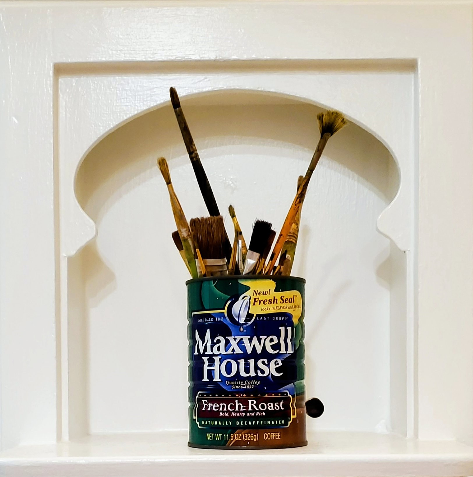 Photo of a Maxwell House coffee house full of paintbrushes in various sizes.