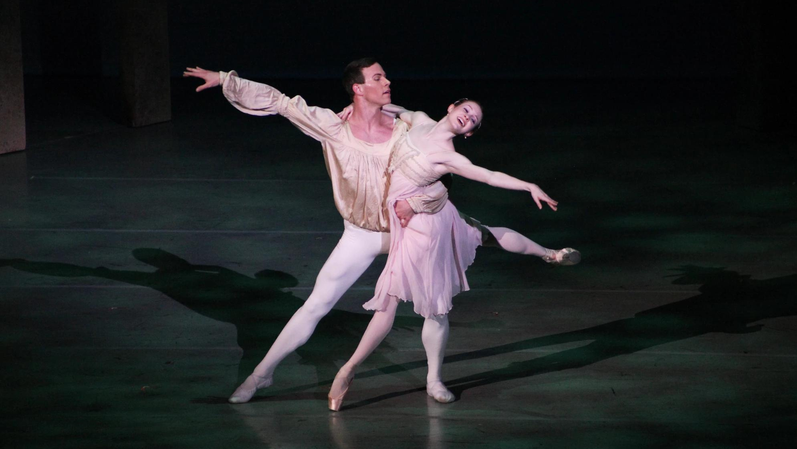 Photo of Michael and Catherine Fothergill on stage dancing in the ballet Romeo & Juliet.