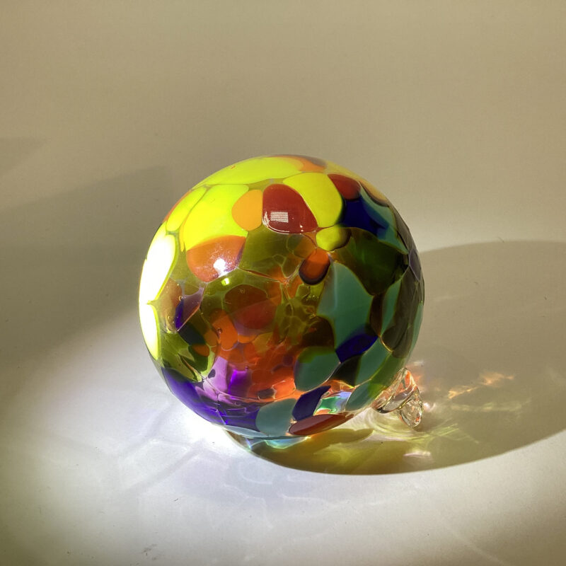 Photo of a multicolored glass ornament.