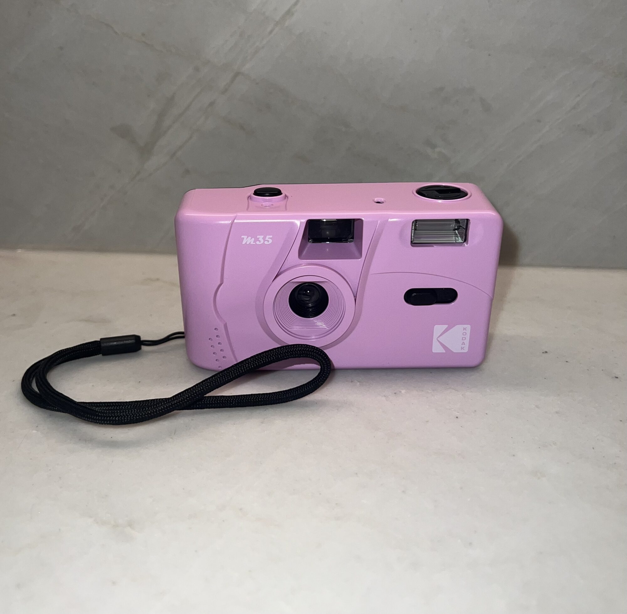 Photo of a pink disposable camera.